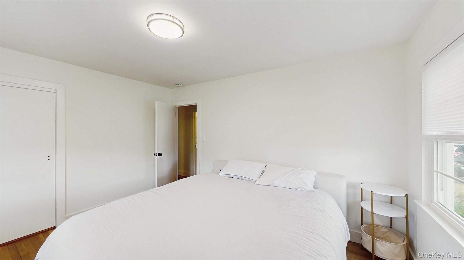 Bedroom with dark wood finished floors