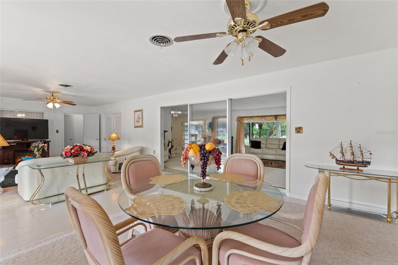 View of family room and informal eating area with view into formal areas.