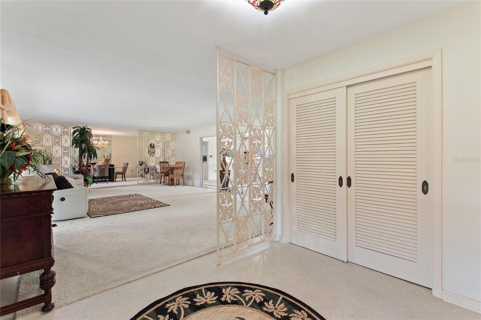 What a beautiful entrance.  The double doors open to a storage closet.