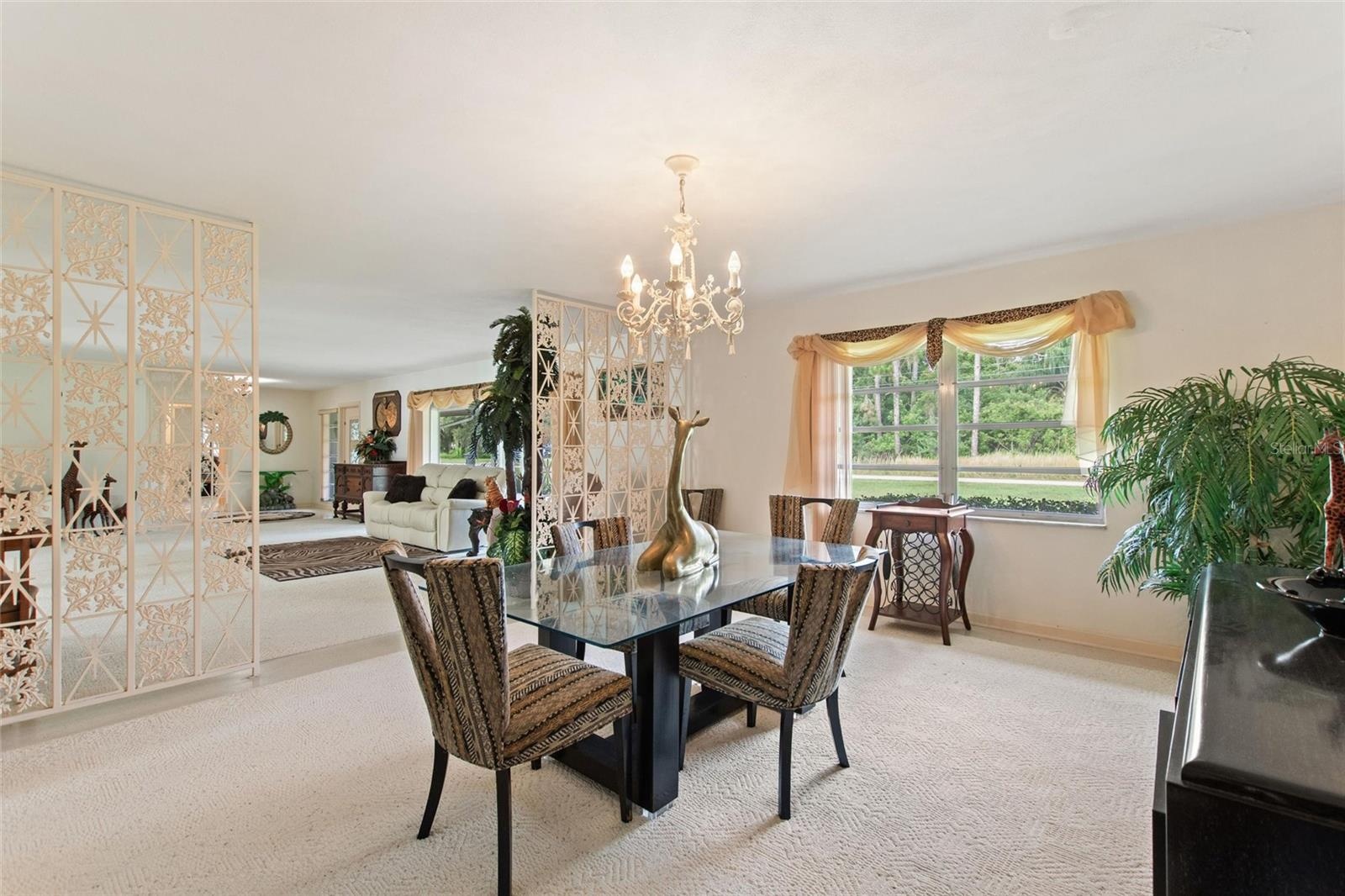 Reverse view of dining room looking back into the living room.  Don't you just love those wrought iron room dividers!