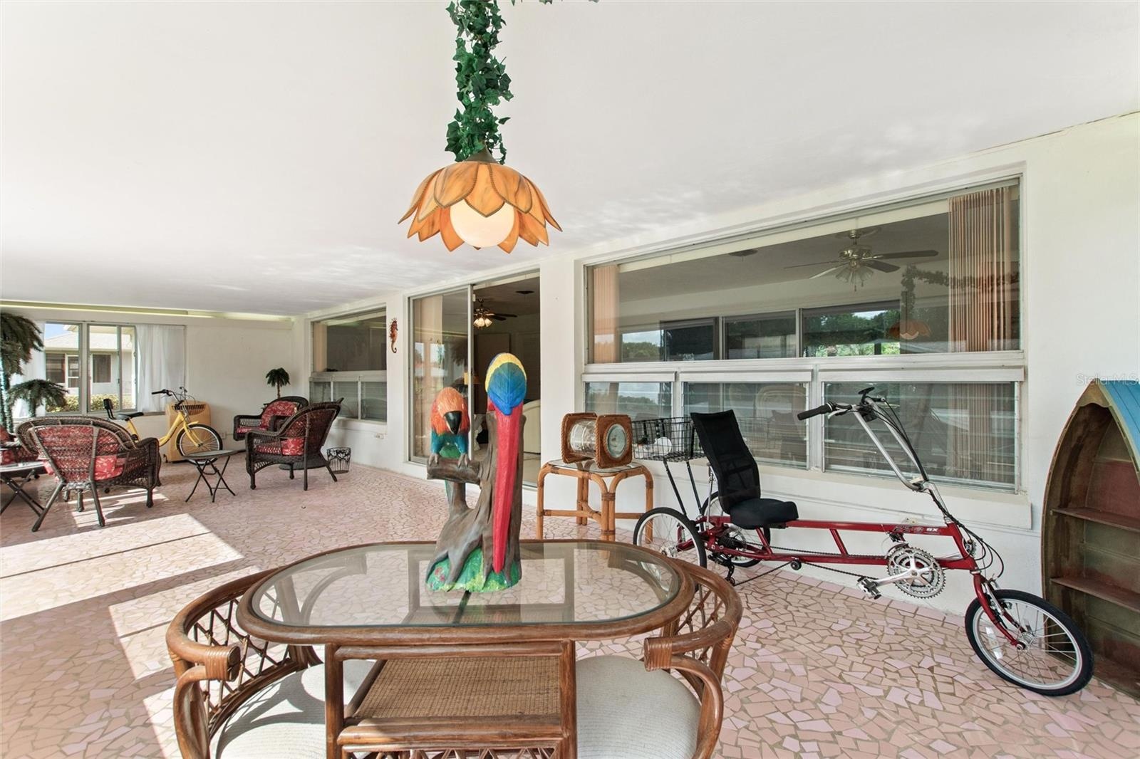 Reverse view of sun room looking back to entry to family room area.