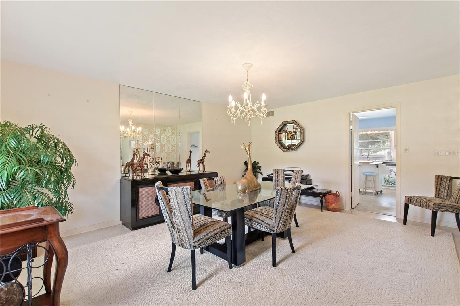 Formal dining room.  The door in the back leads into the kitchen.