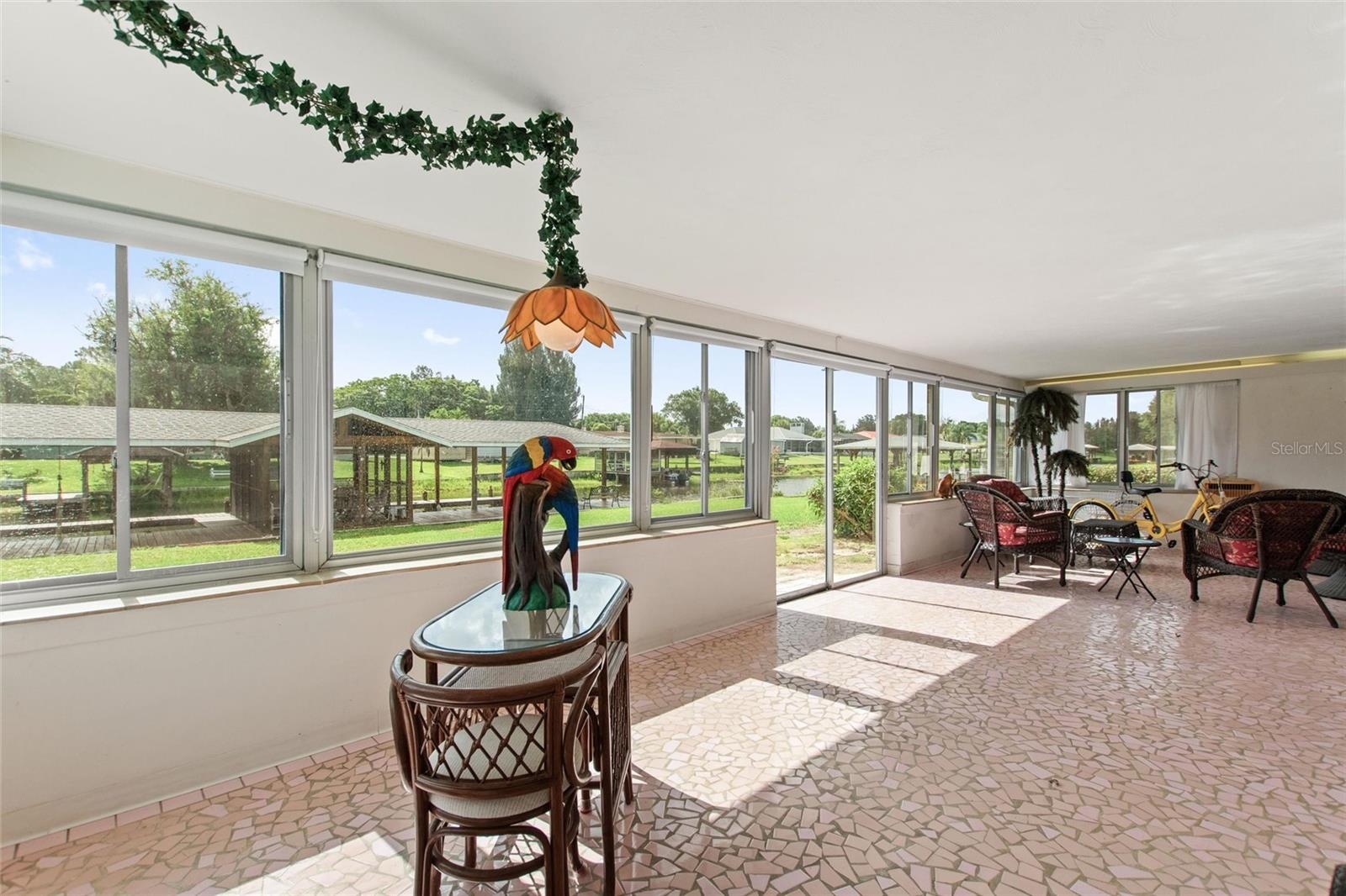 Sun room with view of boat house.