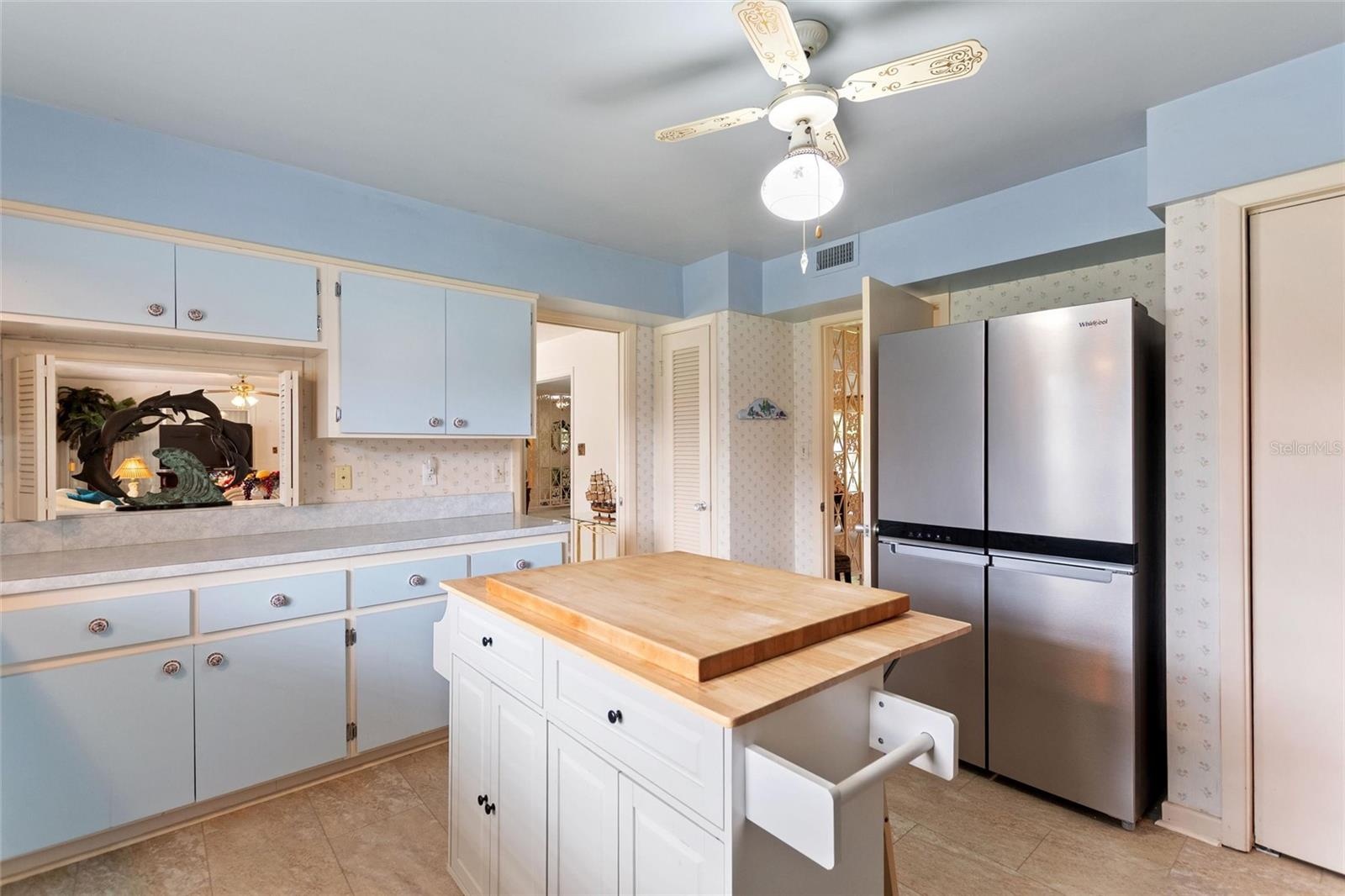 Reverse view of kitchen.  Doorway to the back left leads into the informal areas