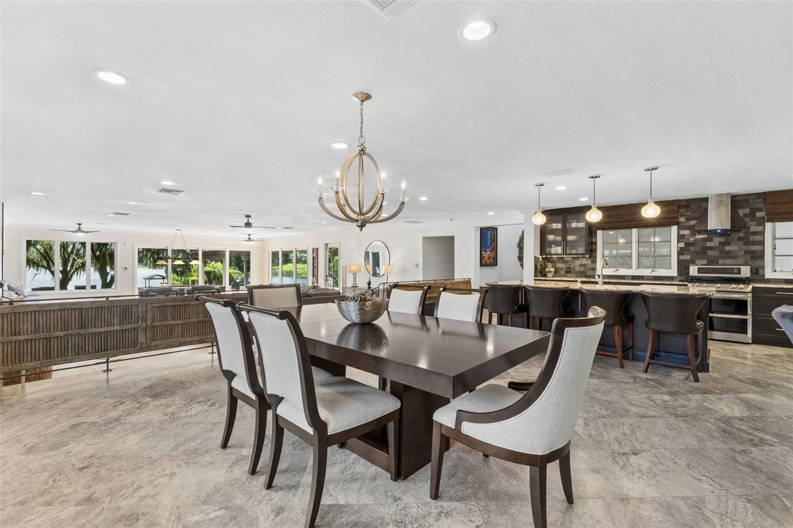 Travertine Floors and Ornamental Lights make this space POP
