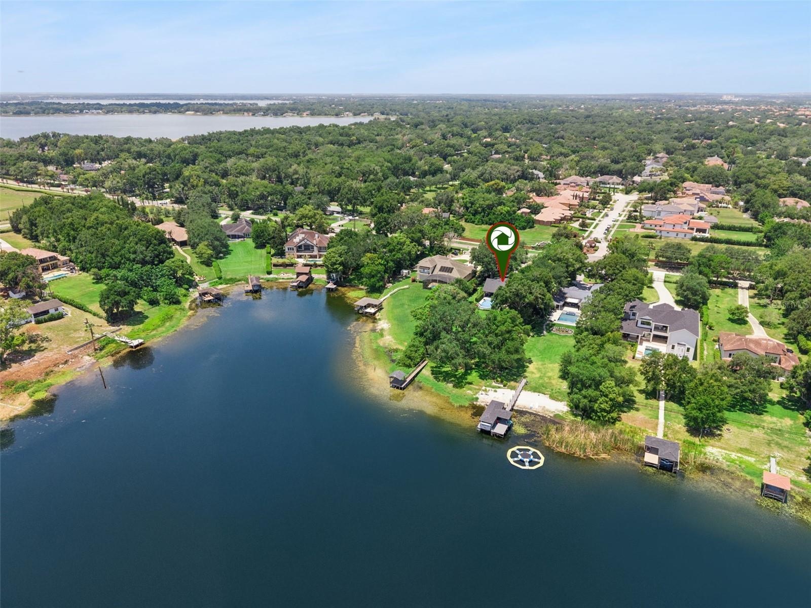 Lake Olivia is an 88 acre private lake.   Chain of Lakes in the background