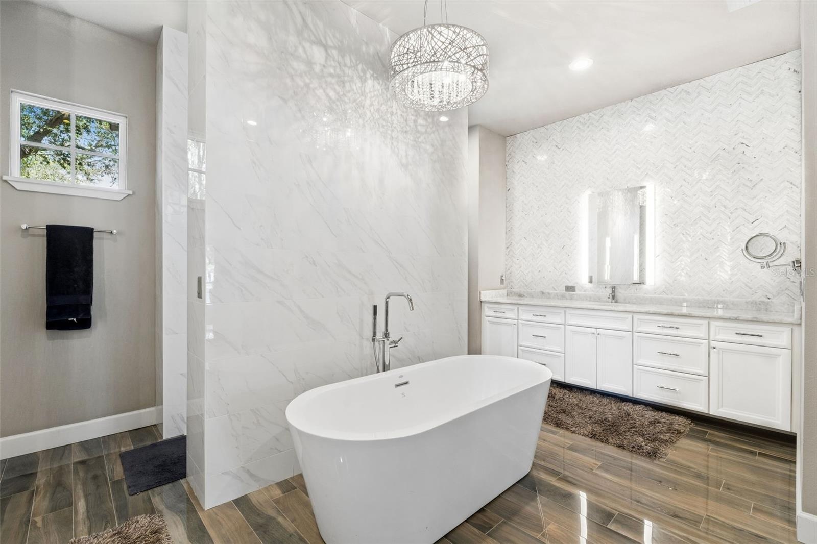 Primary Bathroom; Long separate Counters, Extra Large Soaking Tub and Shower Room.