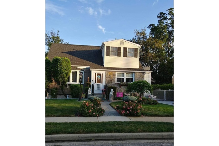 Fieldstone Front With Partial Front Dormer Complimenting Full Rear Dormer