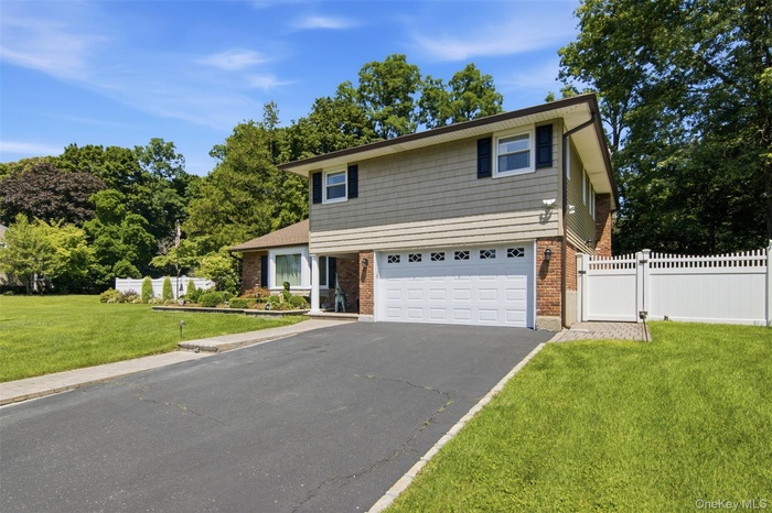 Perfect 4-BR home with CAC, gas heat, generator, 2-car garage, on half acre on VIOLA DRIVE!