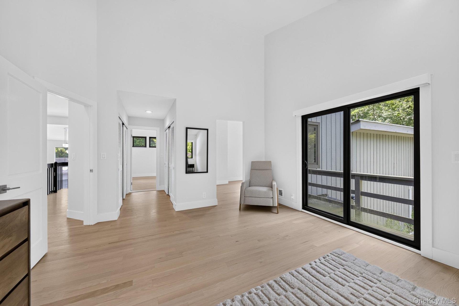 Upstairs Primary showing Balcony, looking towards Closets, Bath and Office/Gym
