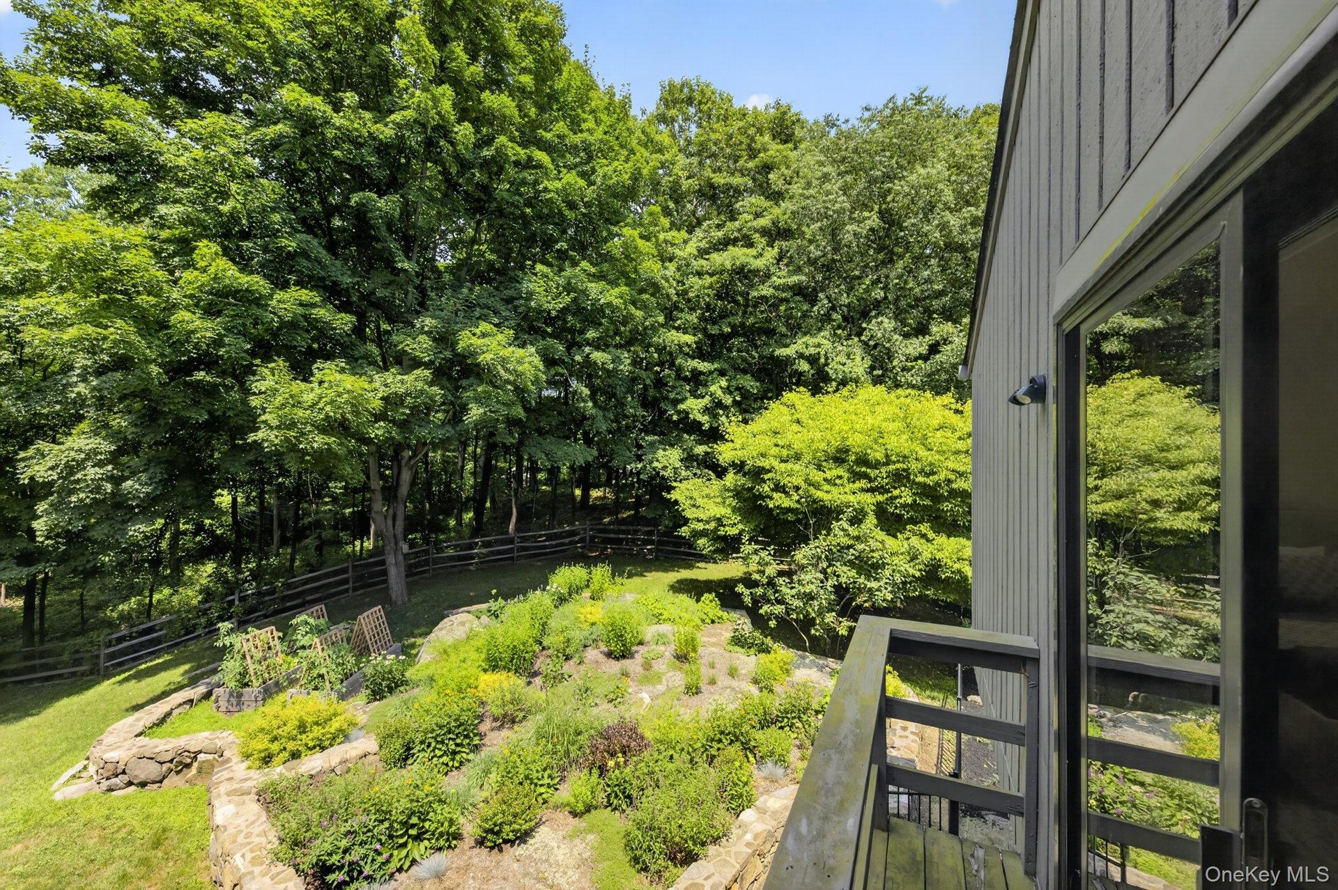 Upstairs Primary Balcony overlooking gardens