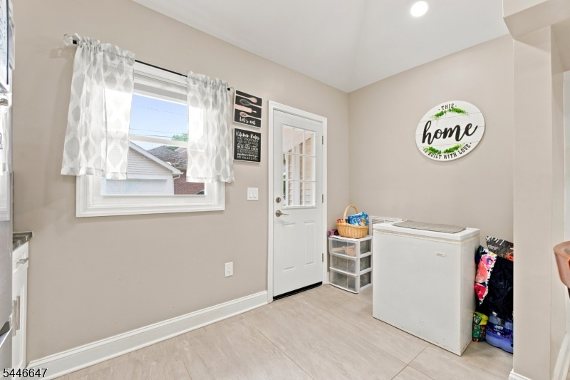 Kitchen leading to backyard