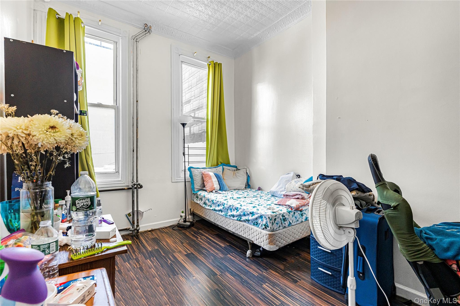 Room featuring wood-finish flooring and white painted walls