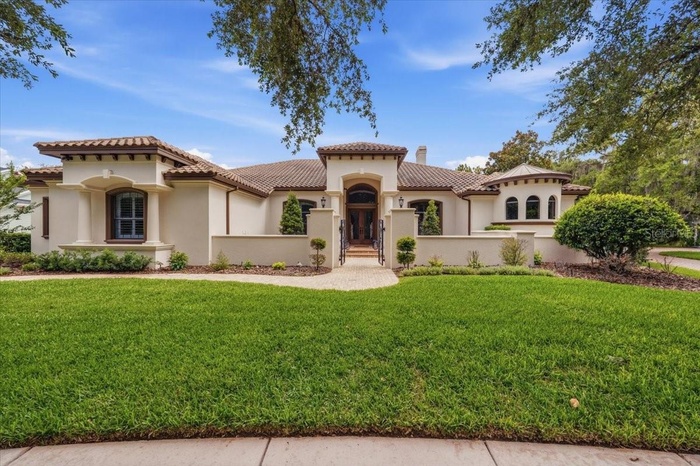 Exceptional custom estate by John C. Fowke in gated FishHawk village.