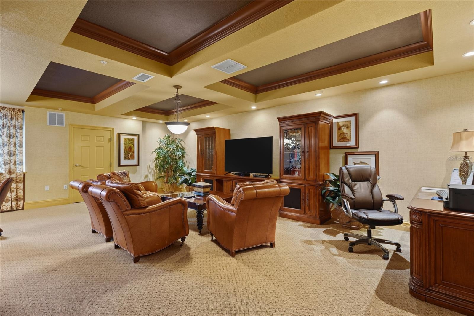 One community room includes a TV, business center with printer, gaming table, and pool table.