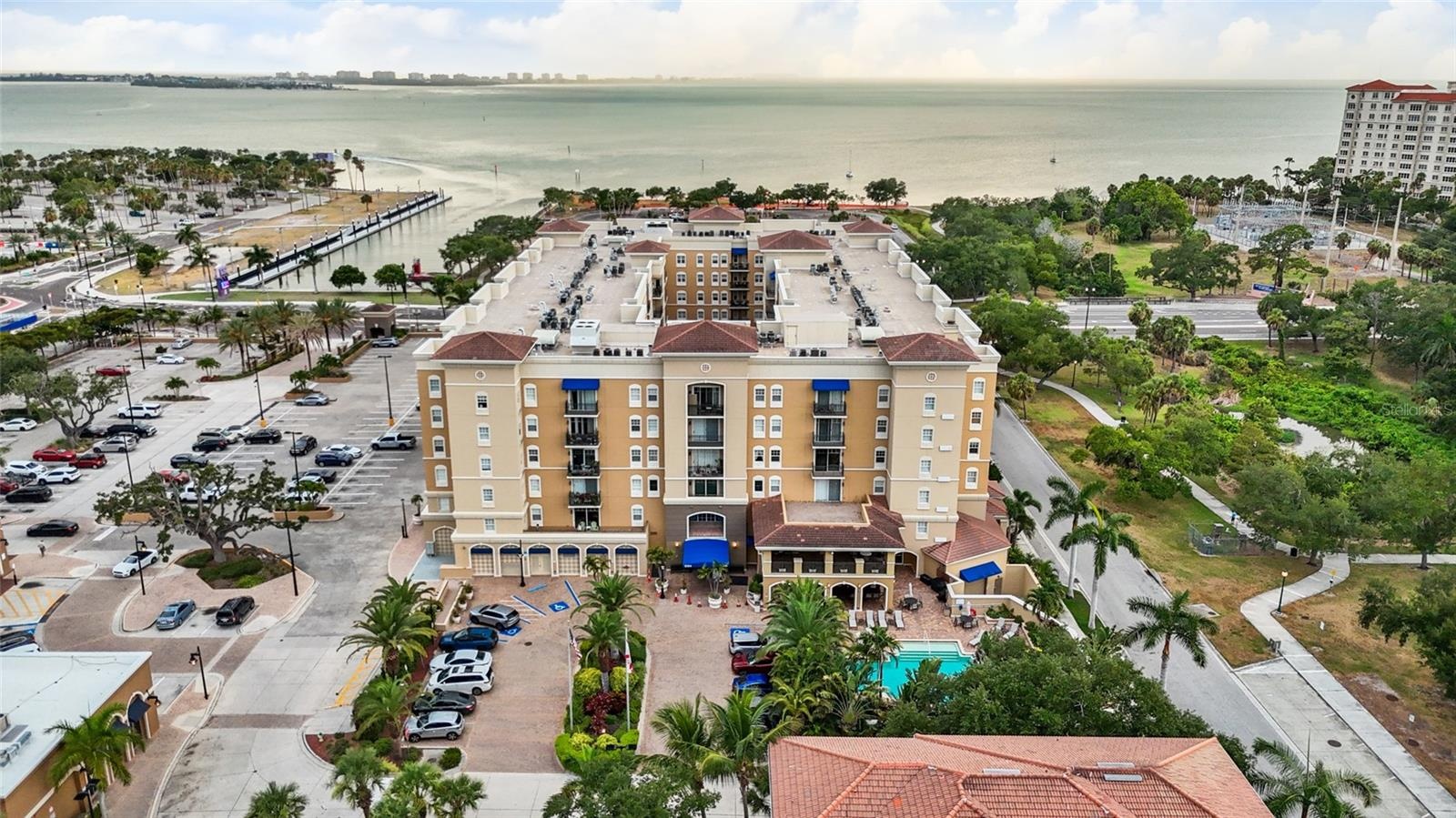The main entrance is on the East side of the building and includes several guest parking spaces.