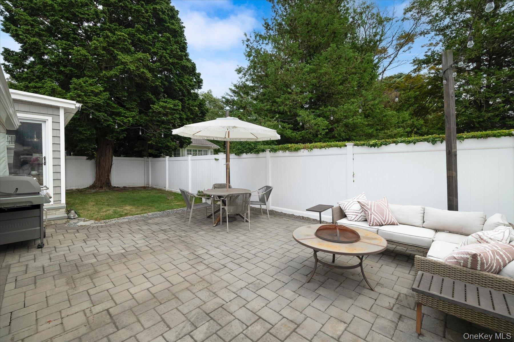 Rear patio with pavers. Fully fenced in property