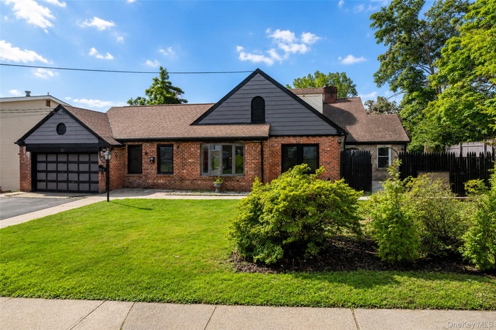 Welcome to 6 Truman Ave. A truly expansive home awaits just behind this picture perfect exterior.