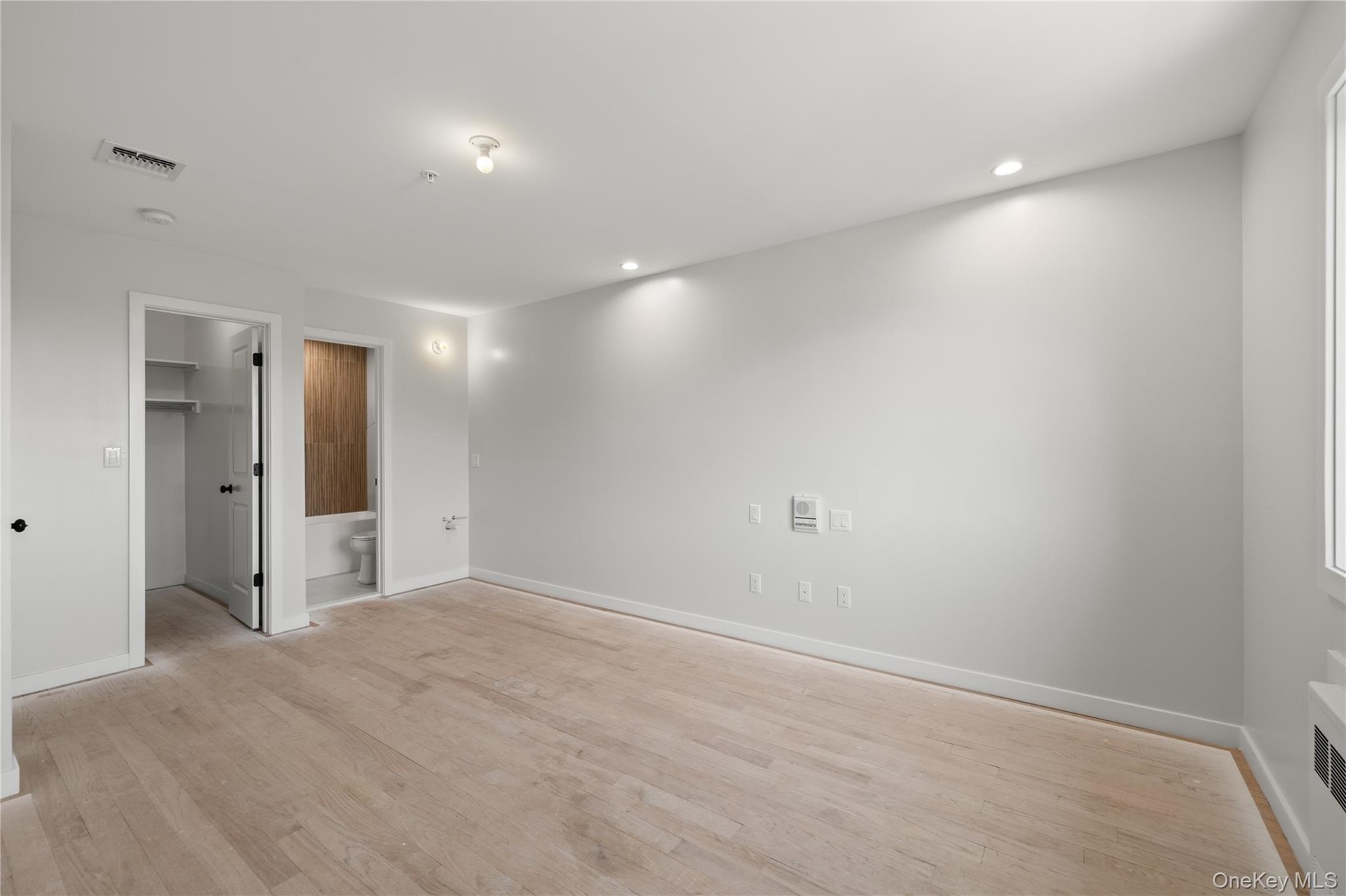 Primary suite with private bath and walk-in closet