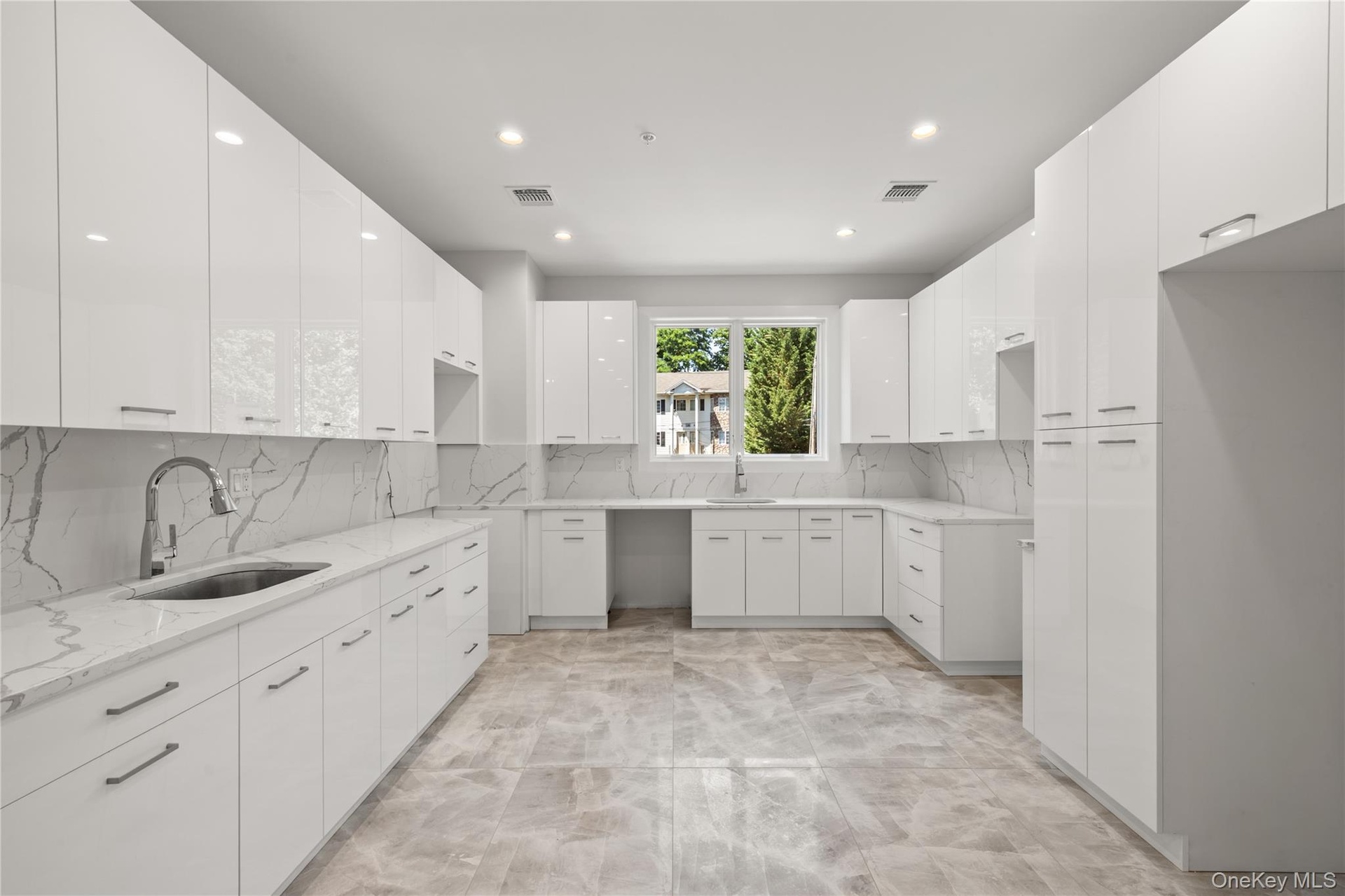Designer kitchen with ample cabinetry