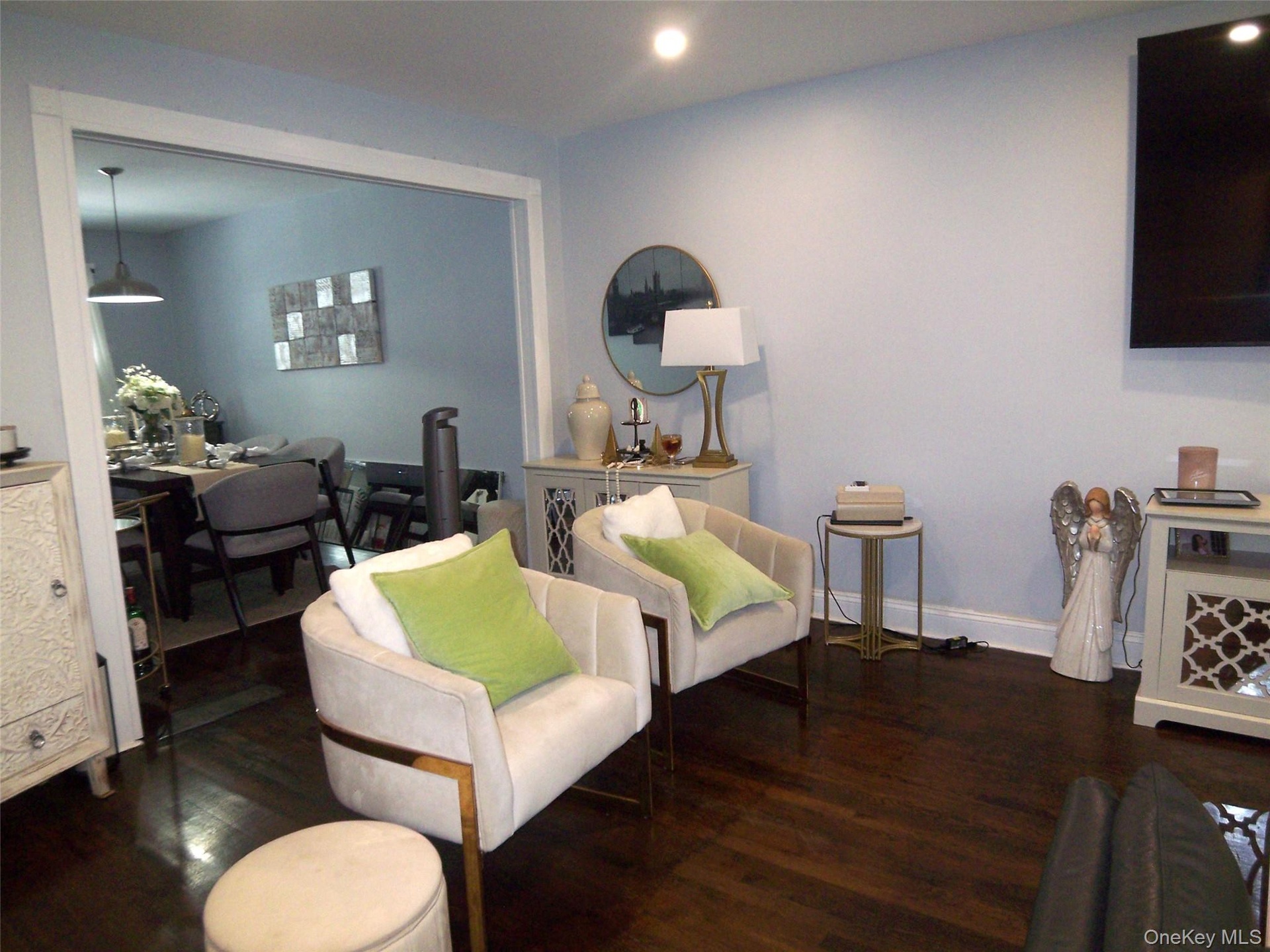 Hardwood-finish flooring extending through an open-concept doorway