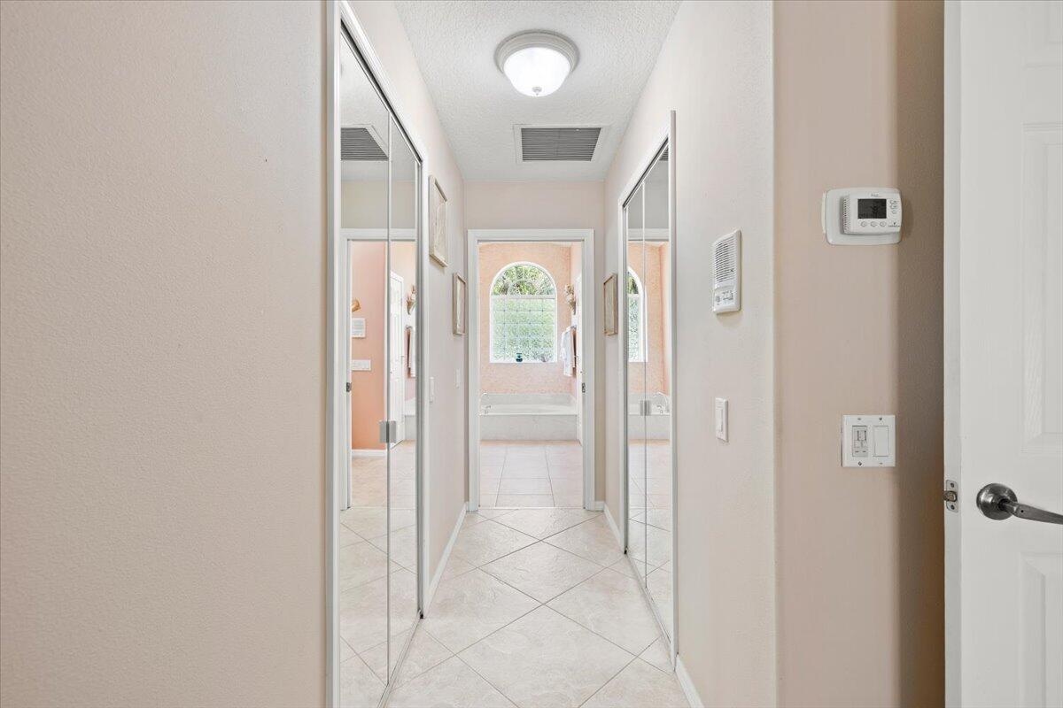 Primary hall with walk-in closets