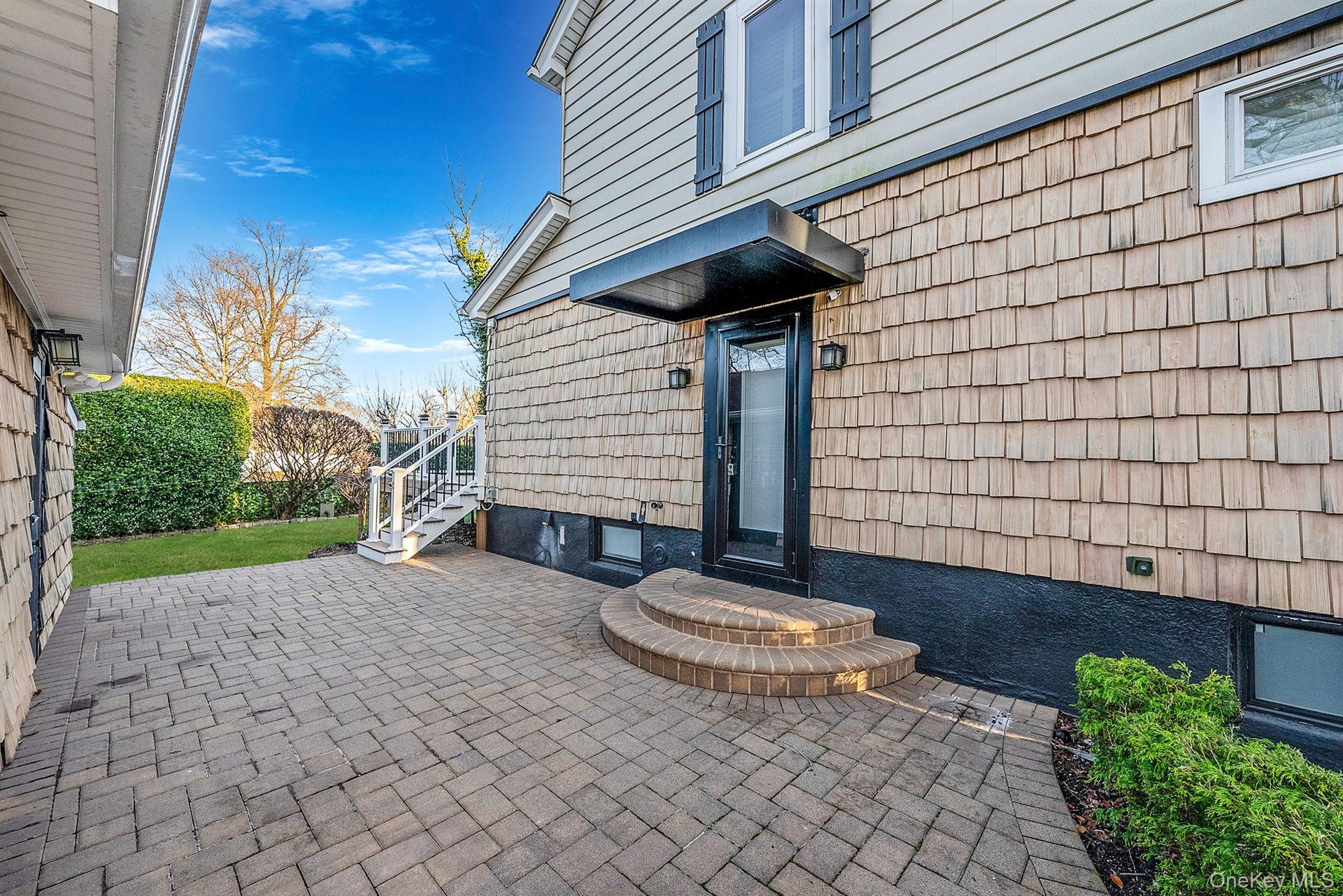 Property entrance featuring a patio area