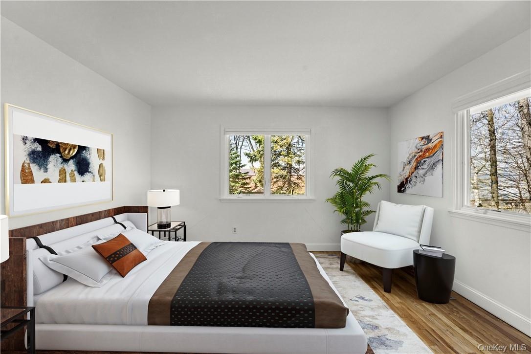 Another view of virtually staged primary bedroom.