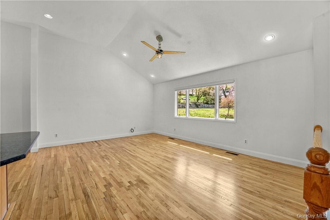 Living Room with Cathedral Ceiling.  Kitchen on the left.