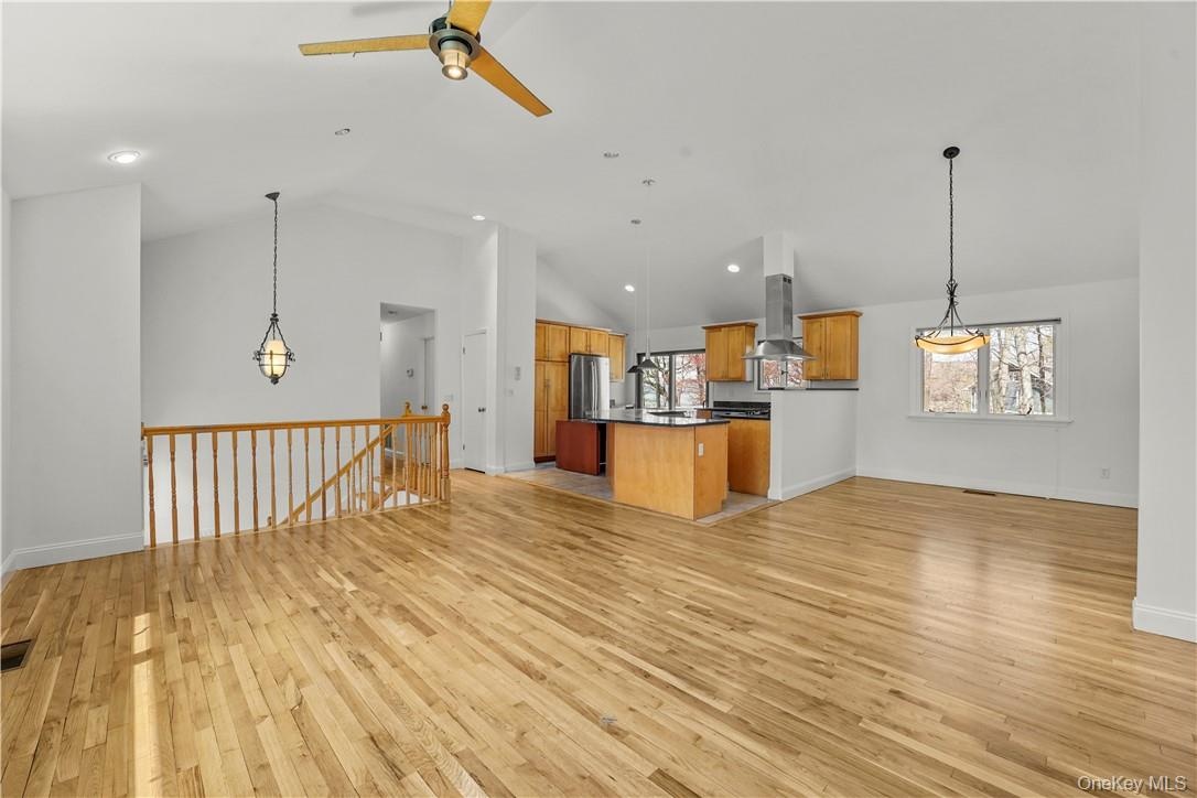 View of Living Room, Dining Room and Kitchen.  Hard wood floors have been polished and wall freshly painted.