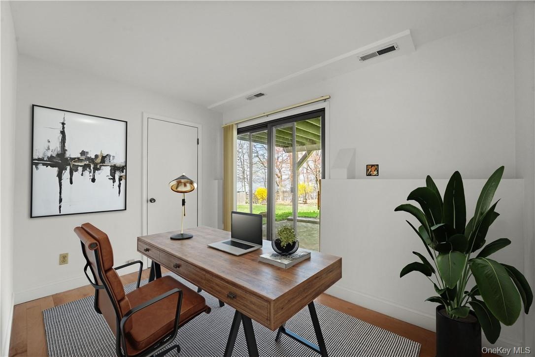 Virtually staged home office/den.