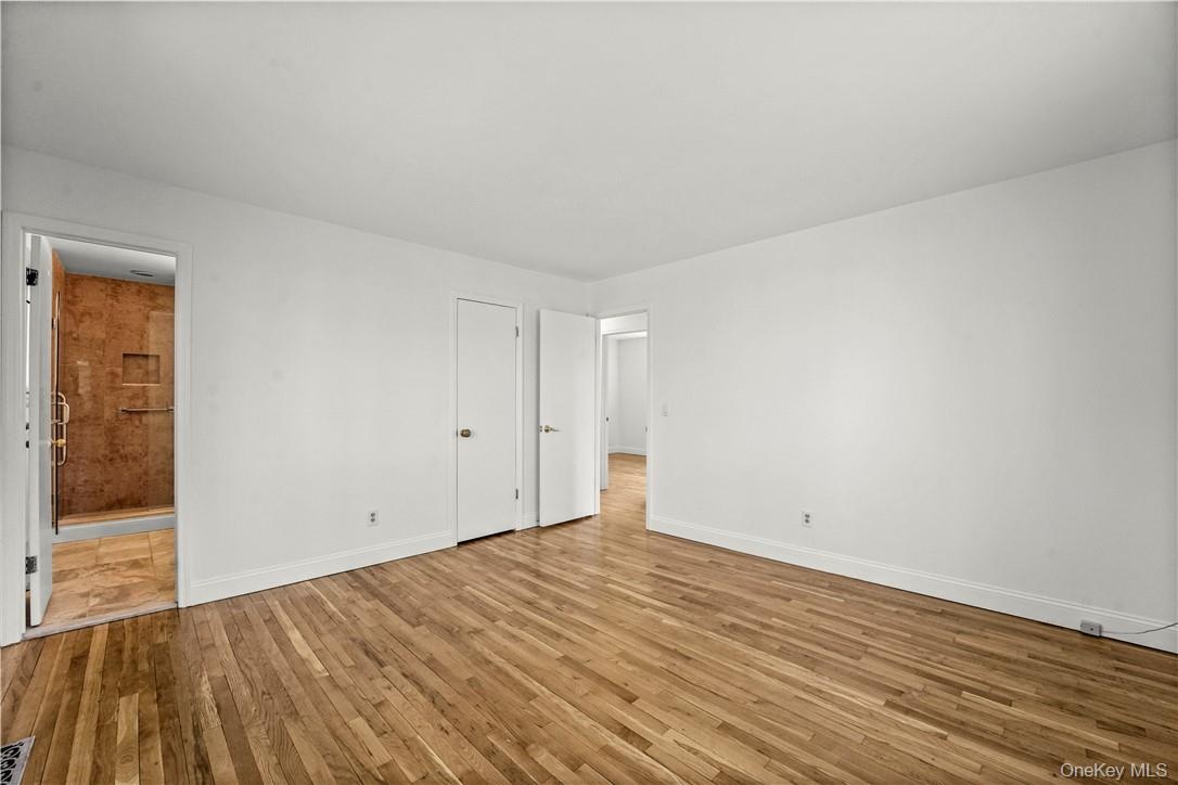 Primary Bedroom en suite with nice size shower and walk-in closet.