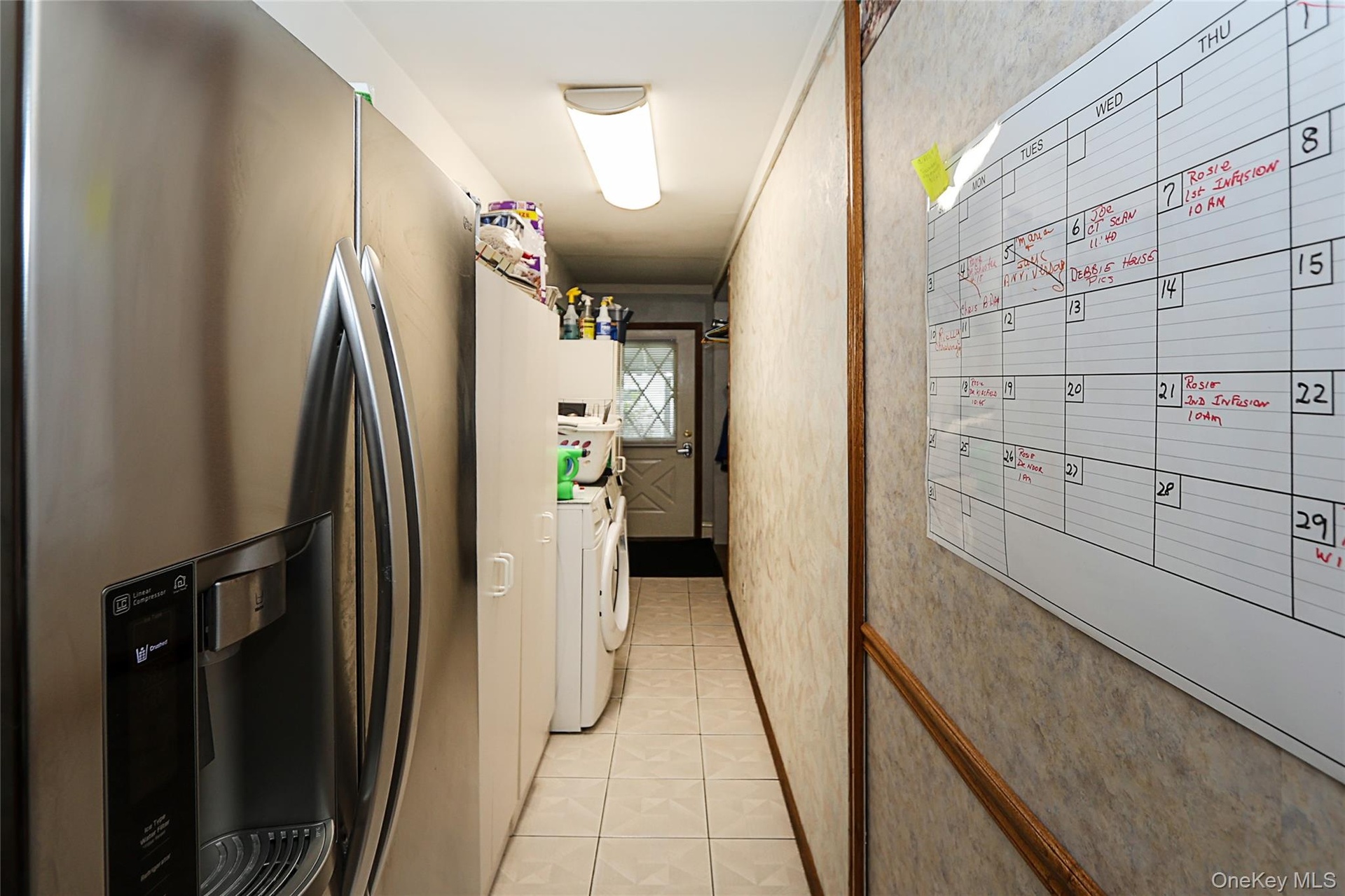 Hall with Laundry and Extra Refridgerator.