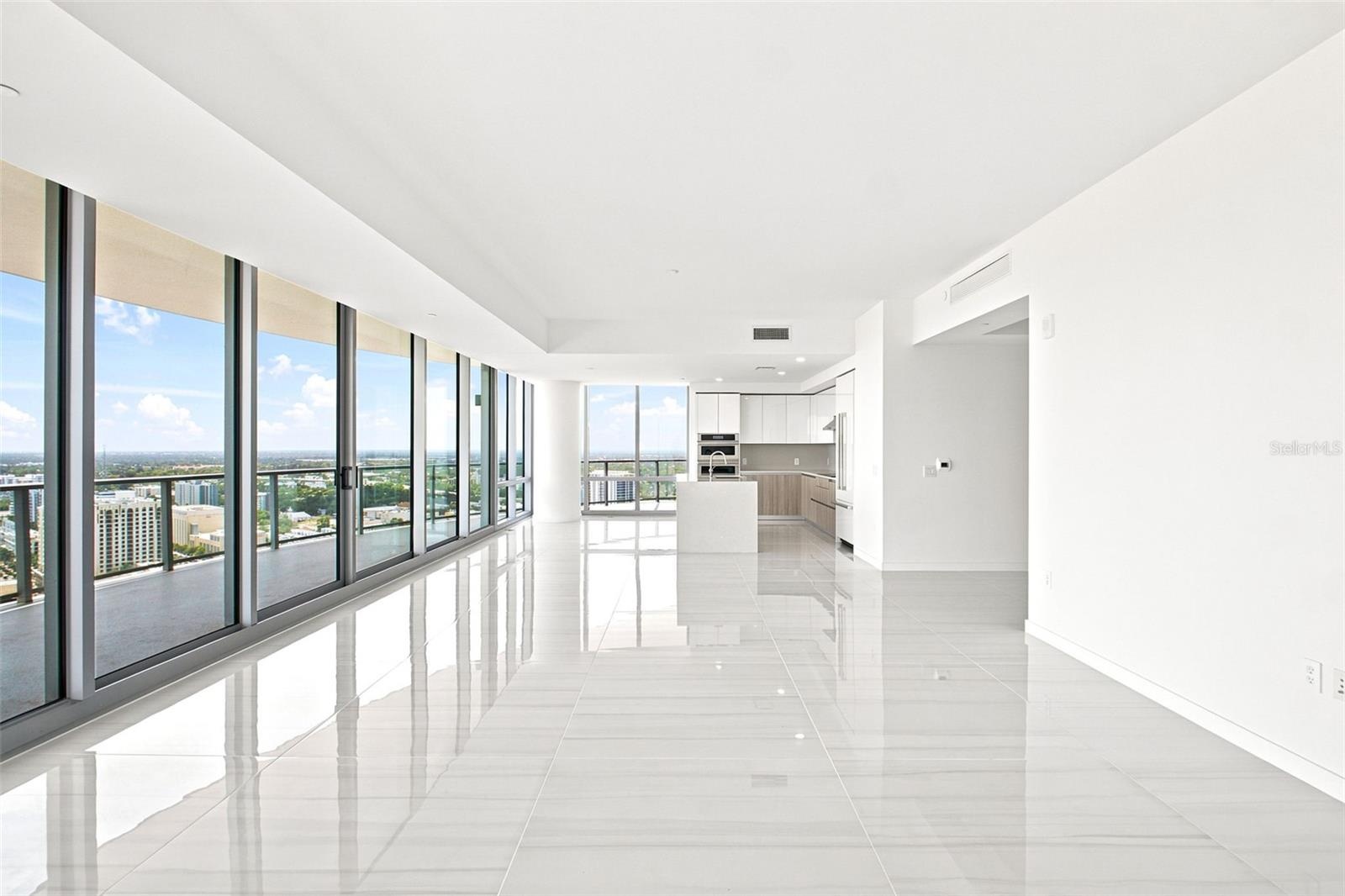 The wall of floor to ceiling windows maximize the view.