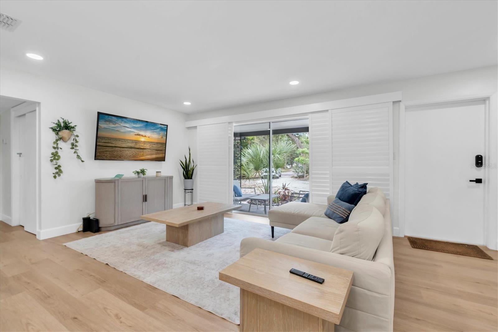 Living Room w/ Large Windows+Plantation Shutters
