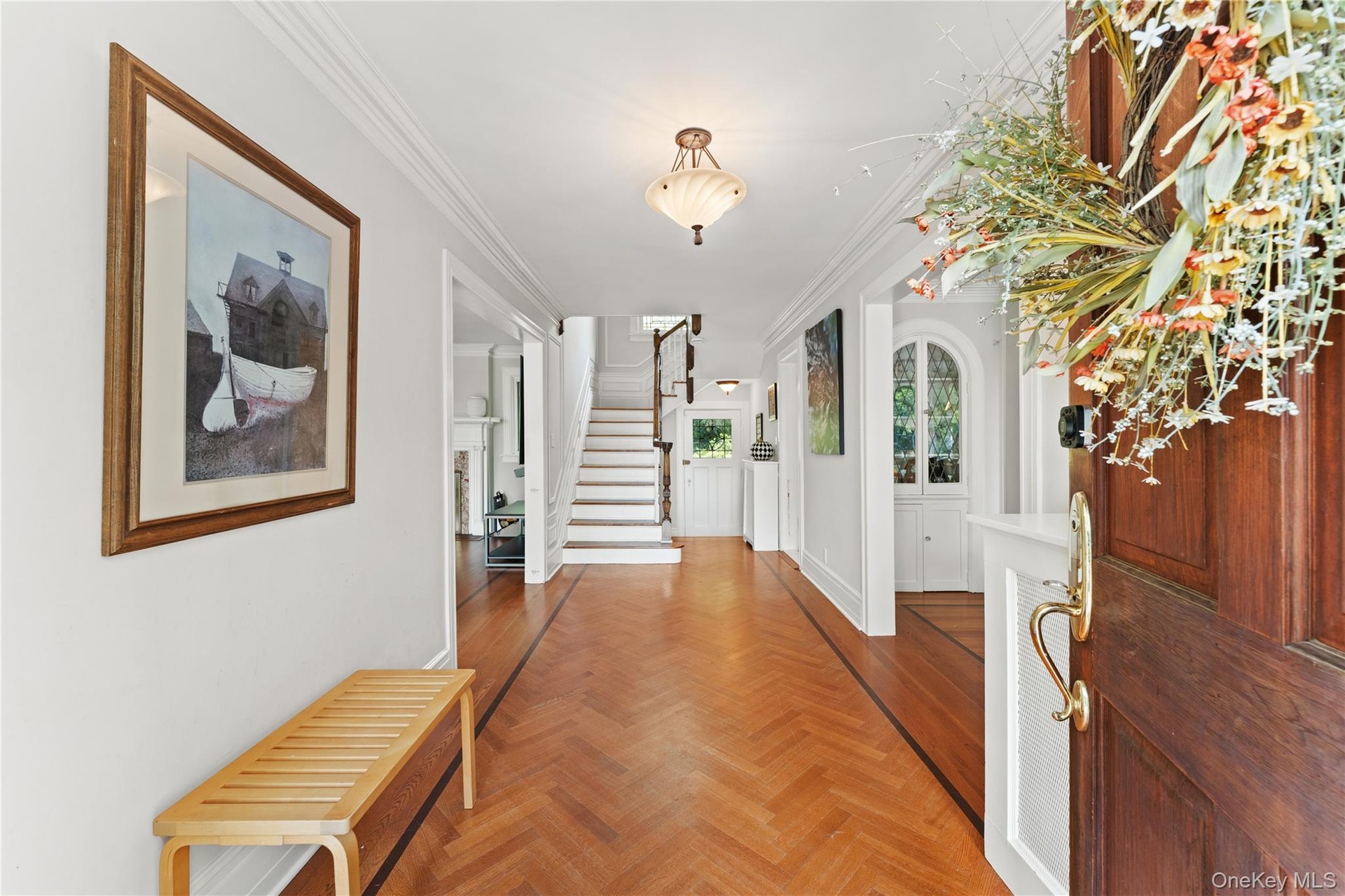 This exceptional 6 bedroom colonial features gorgeous herringbone floors.