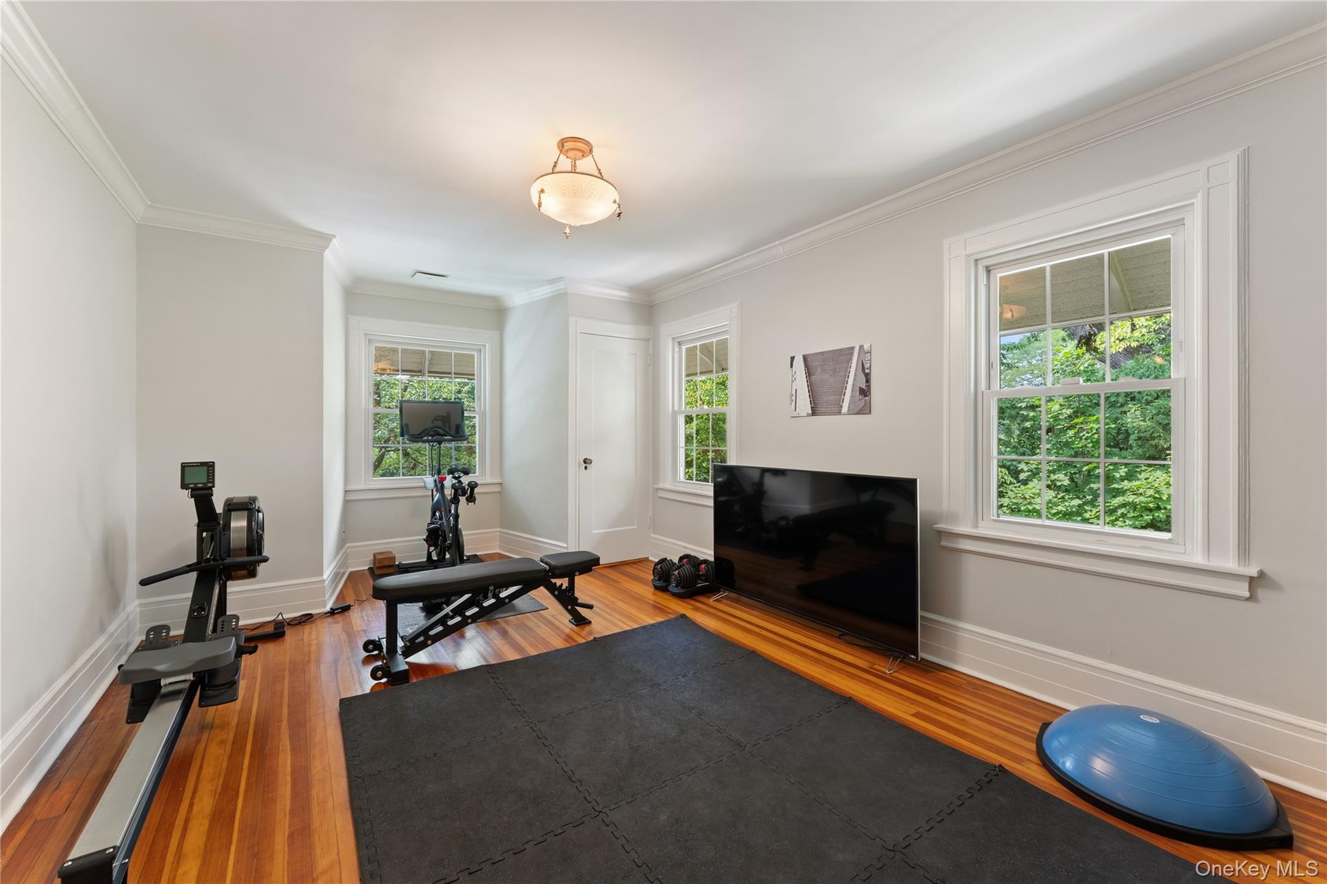 This is the second level  bedroom with full bathroom that is being used as a gym.