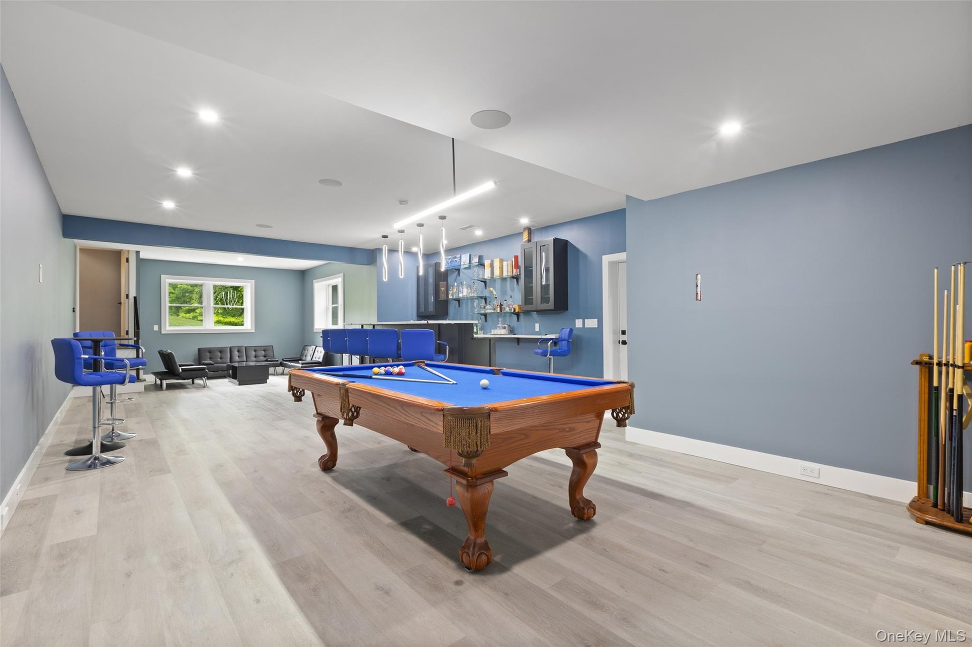 Finished Basement with a lounge area and billiards table
