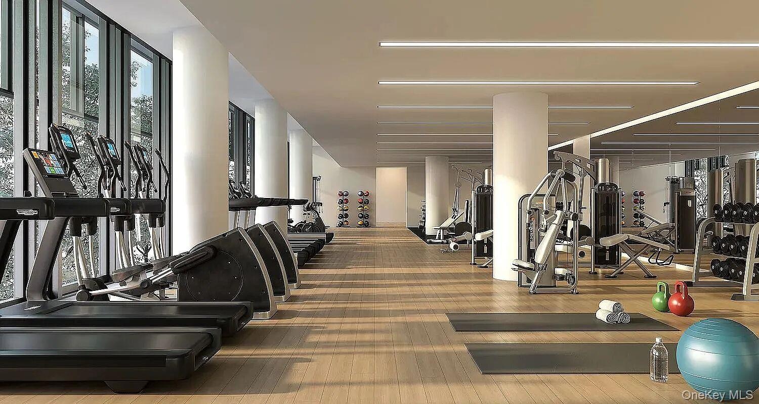 Fitness facility featurin a variety of cardio equipment, strength training machines, and free weights located in Common Area on 2nd Floor