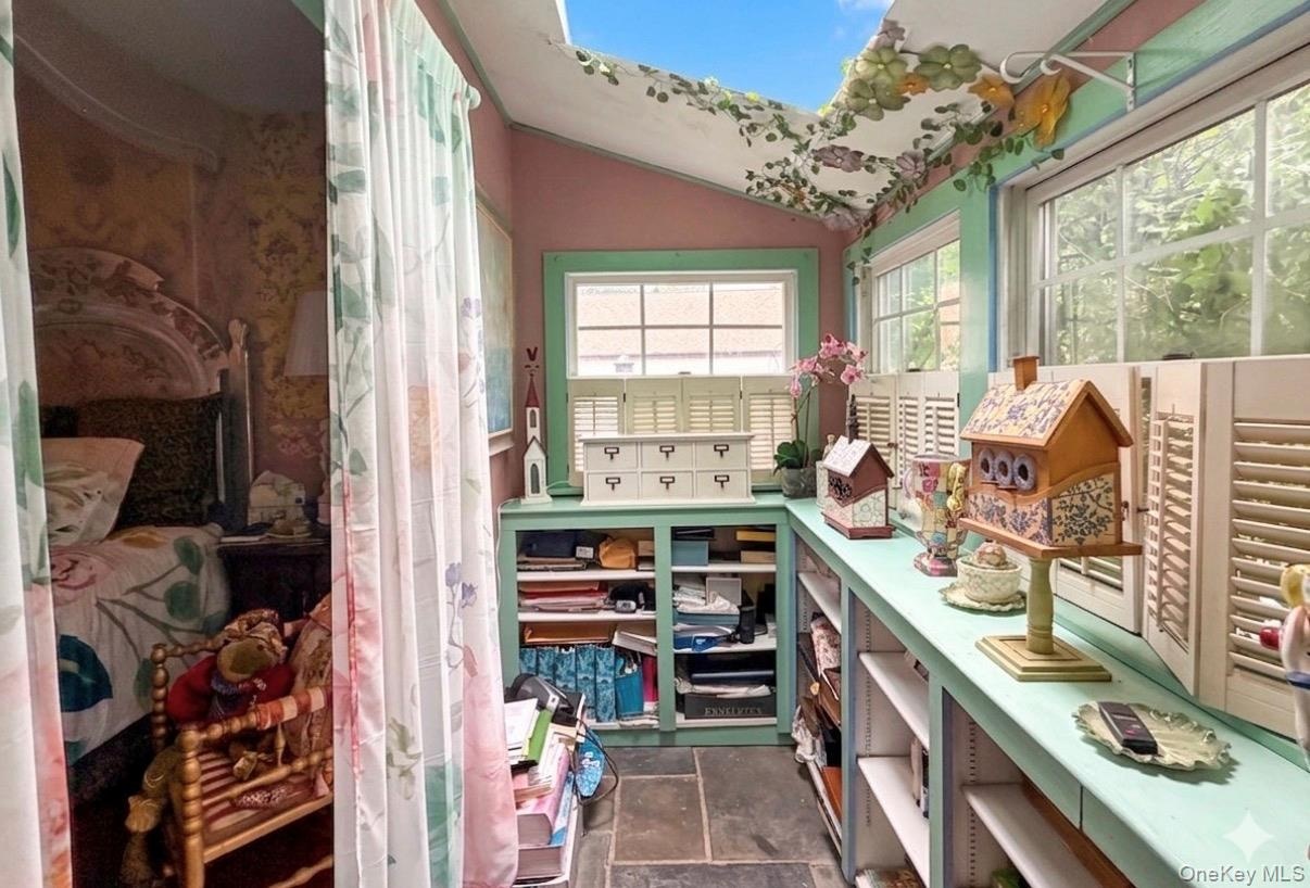 Enclosed porch of the Primary Bedroom with skylight