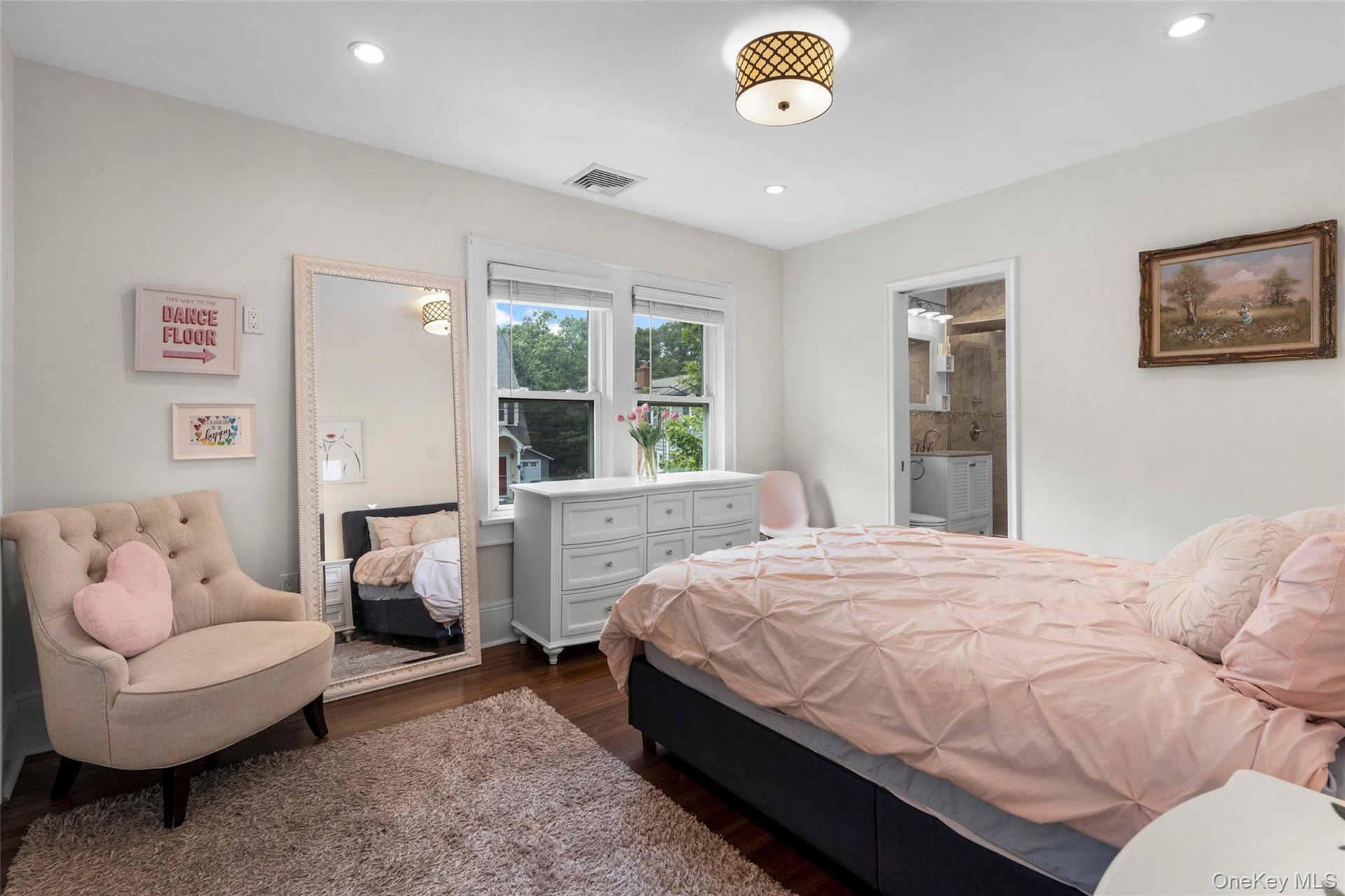 Spacious primary suite with his and hers closets.