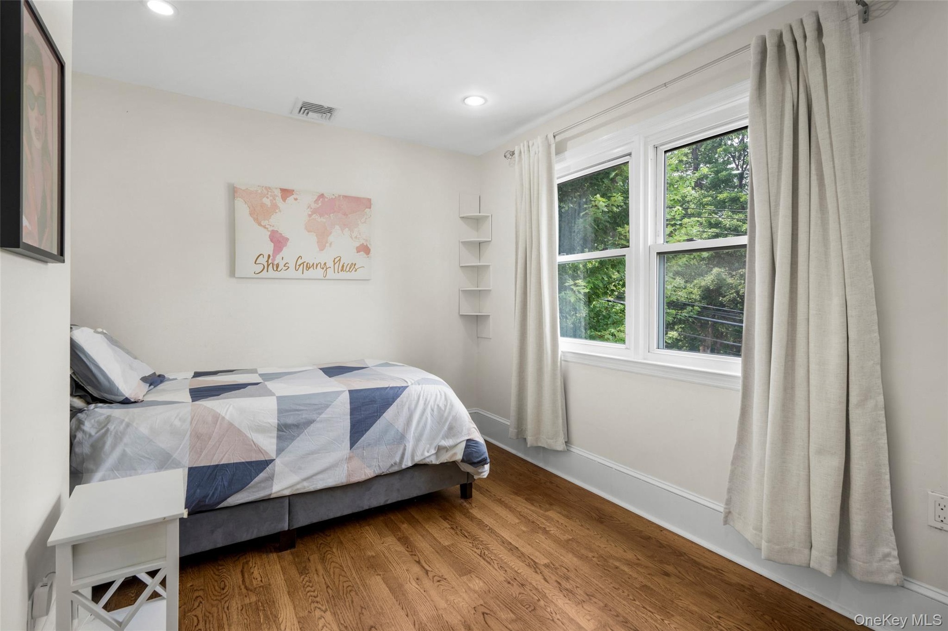 Bright bedroom with a walk-in closet.