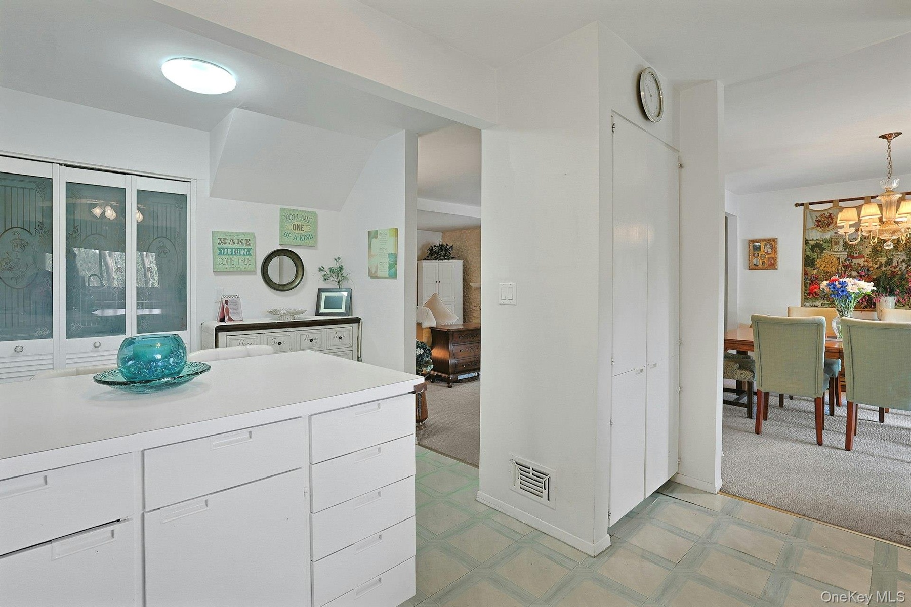 The closet underneath the clock is a very generous size pantry area. All of your supplies can be neatly packed away.