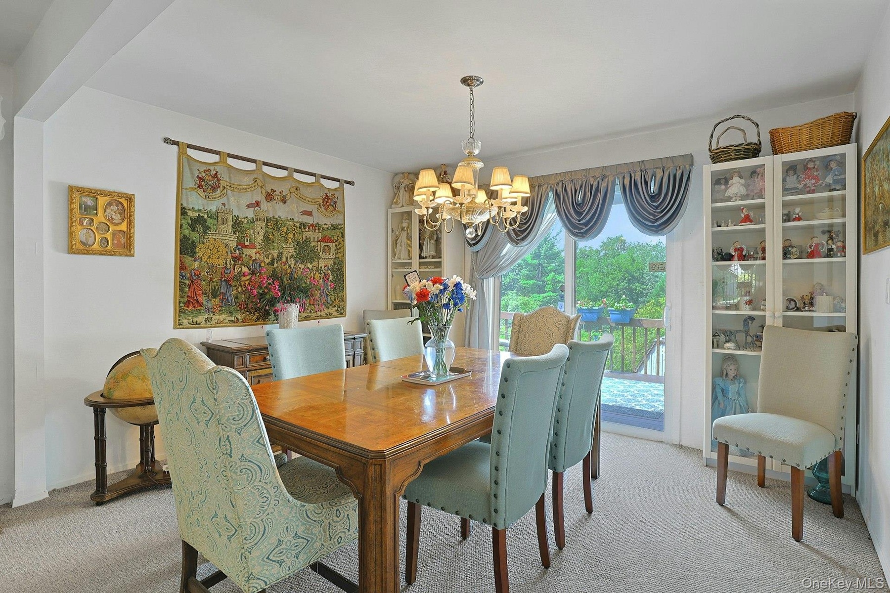 Here is the beautiful Dining area with sliding glass doors out to a very generous size deck.
