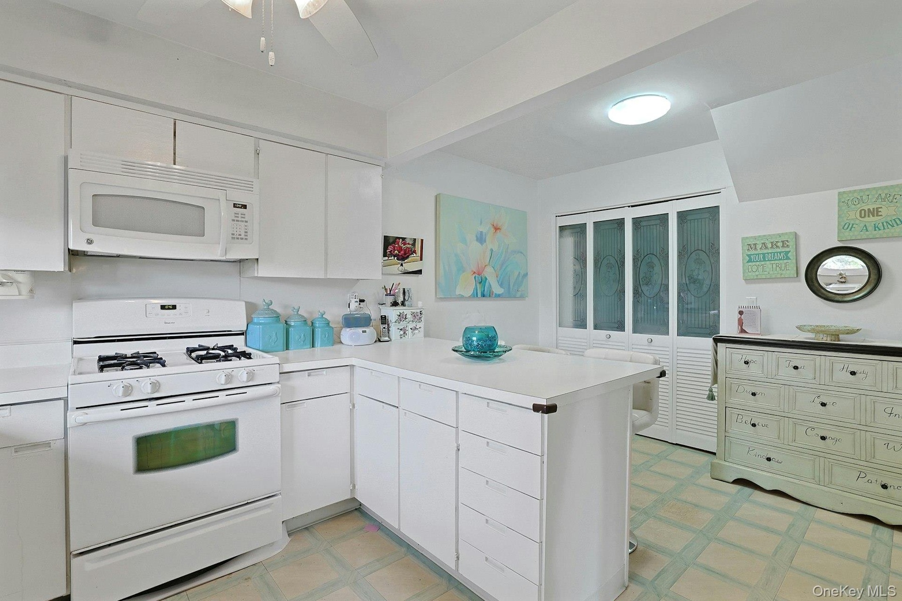 The doors here in the Kitchen go to the Laundry area which offers additional storage space as well.