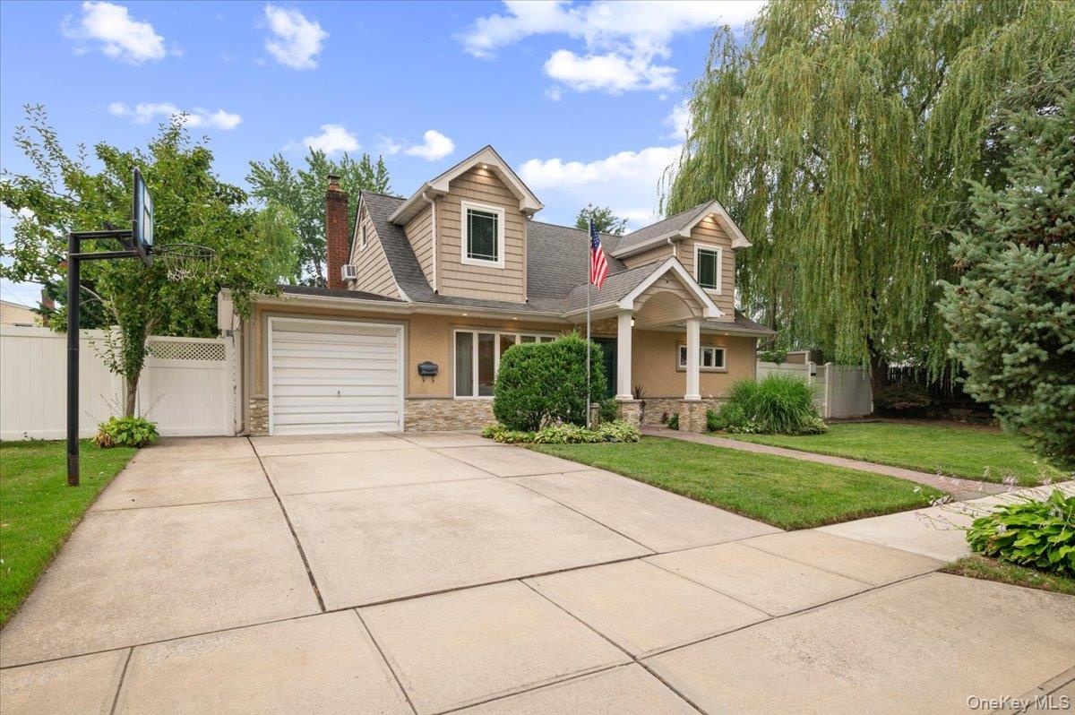 Custom Oversized Portico Welcomes you into this Unique Home while the Double Driveway has enough room for four cars or plenty of on street parking for