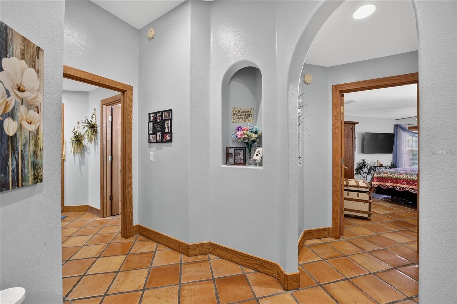 Corridor Providing Access to the Primary Suite & Secondary Bedroom with Private Bath