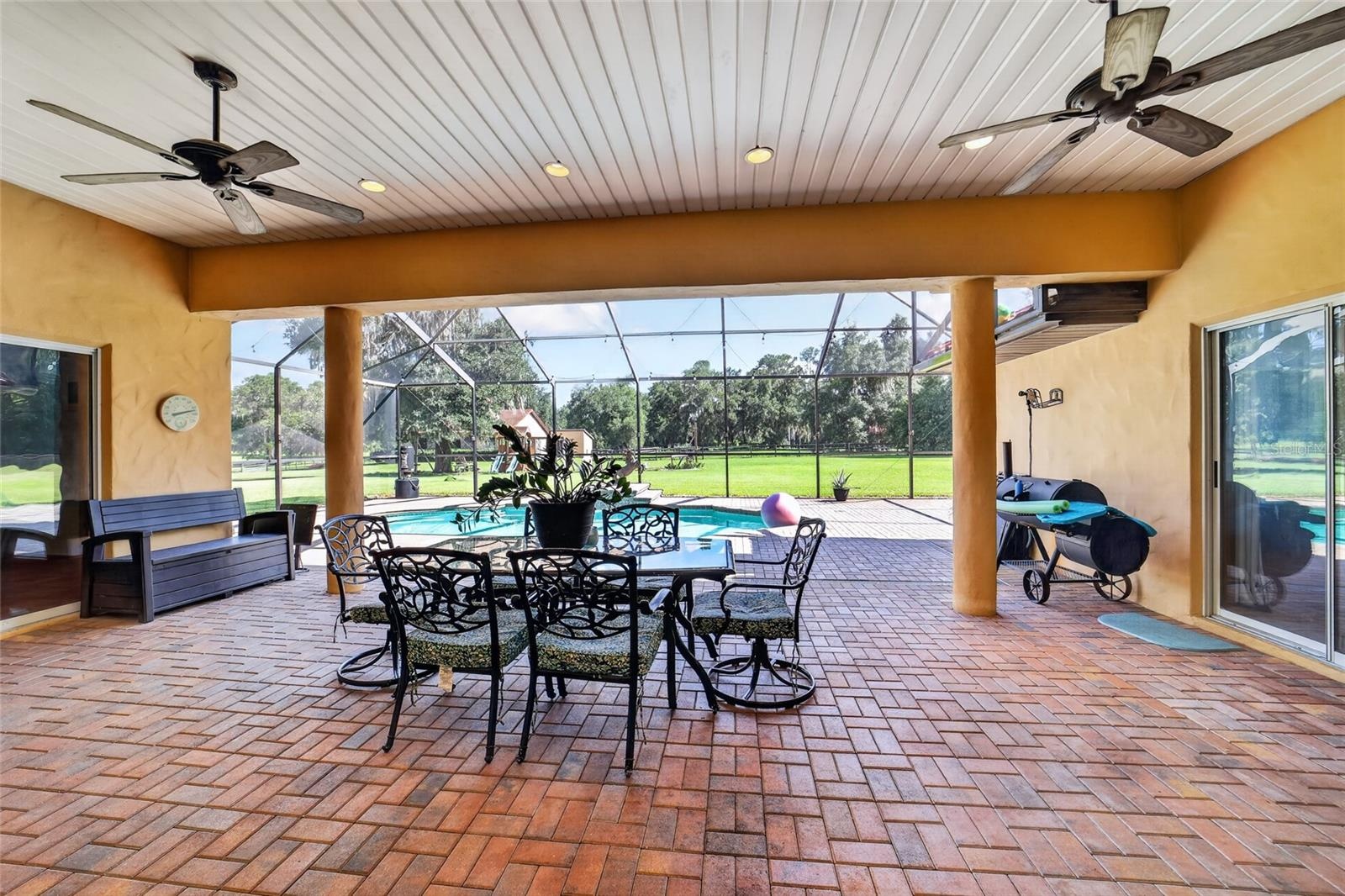 Expansive Covered & Screened Lanai with Paver Pool Deck