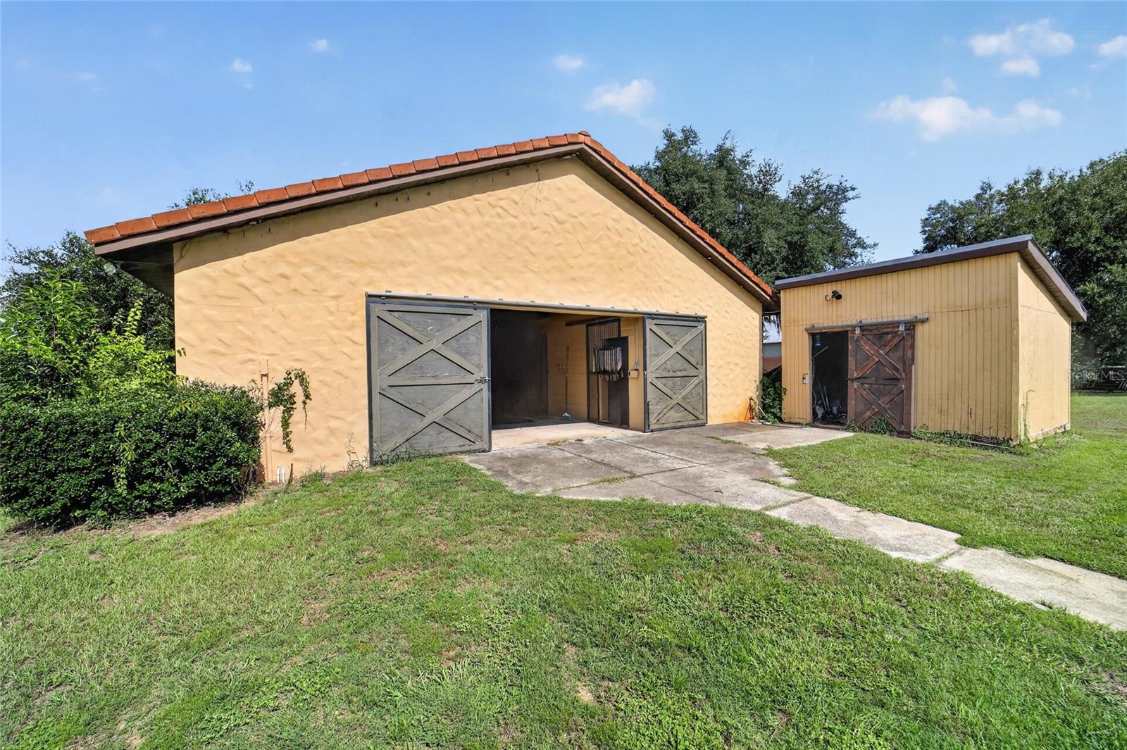 5-Stall Center-Aisle Barn with Adjacent Hay and Feed Storage Shed