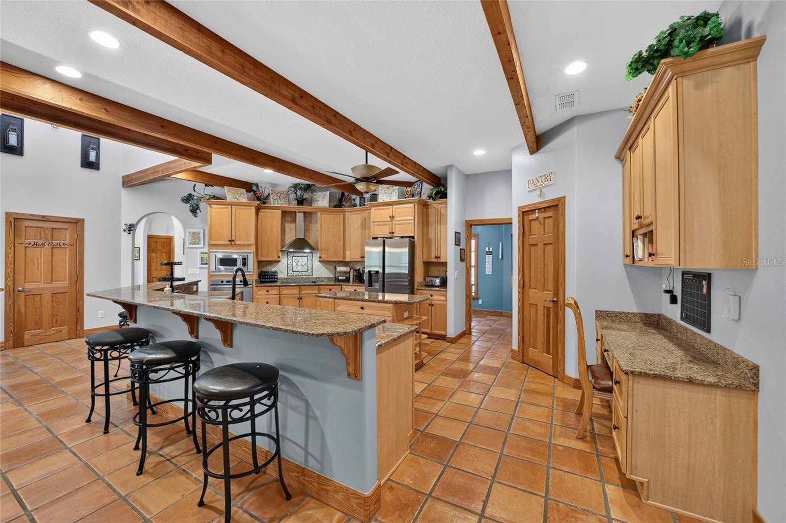 Gourmet Kitchen with Granite Countertops, Breakfast Bar and Study Desk